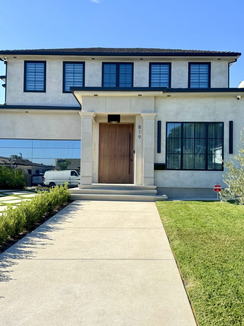 Modern two-story house with driveway and lawn